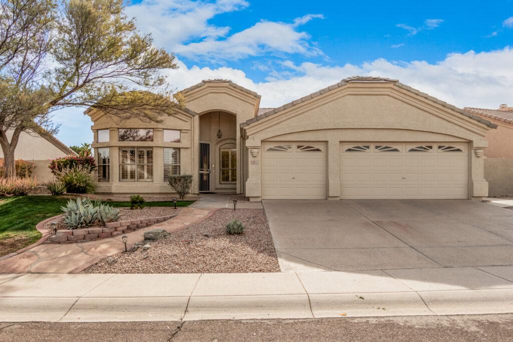 Front view of a home with triple garage in Phoenix Arizona